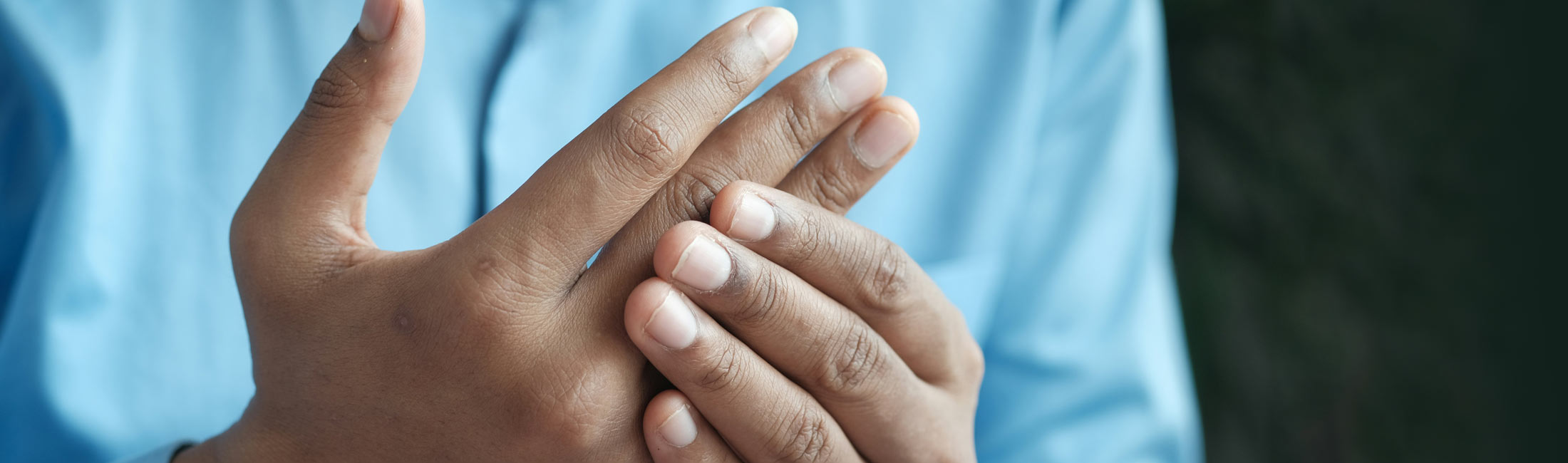 person rubbing their hands