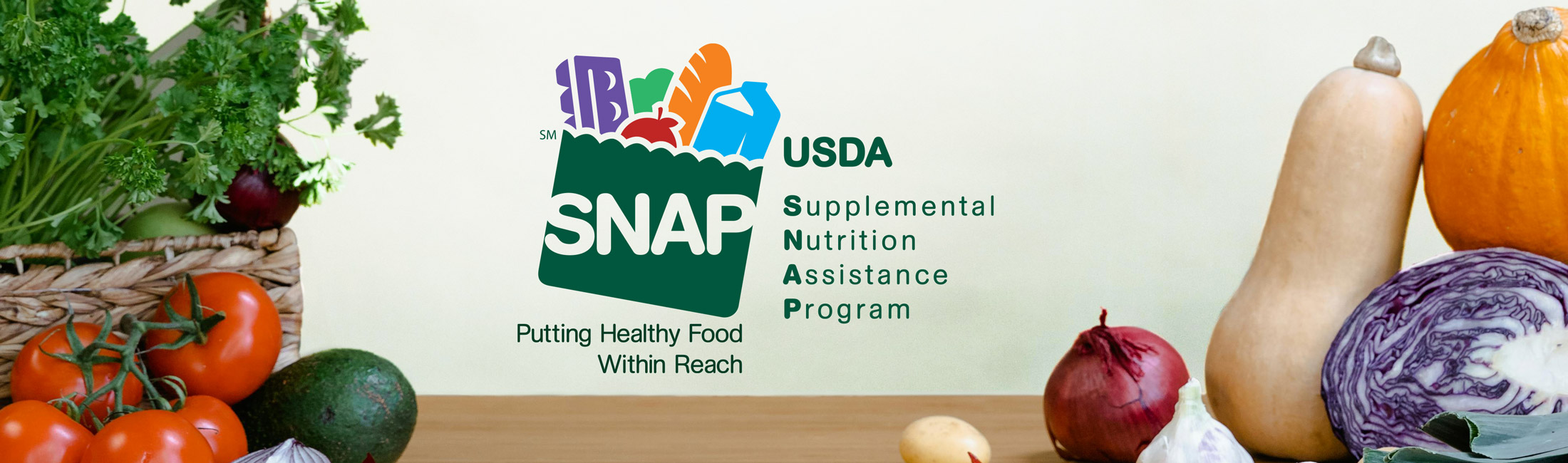 SNAP logo with vegetables on table