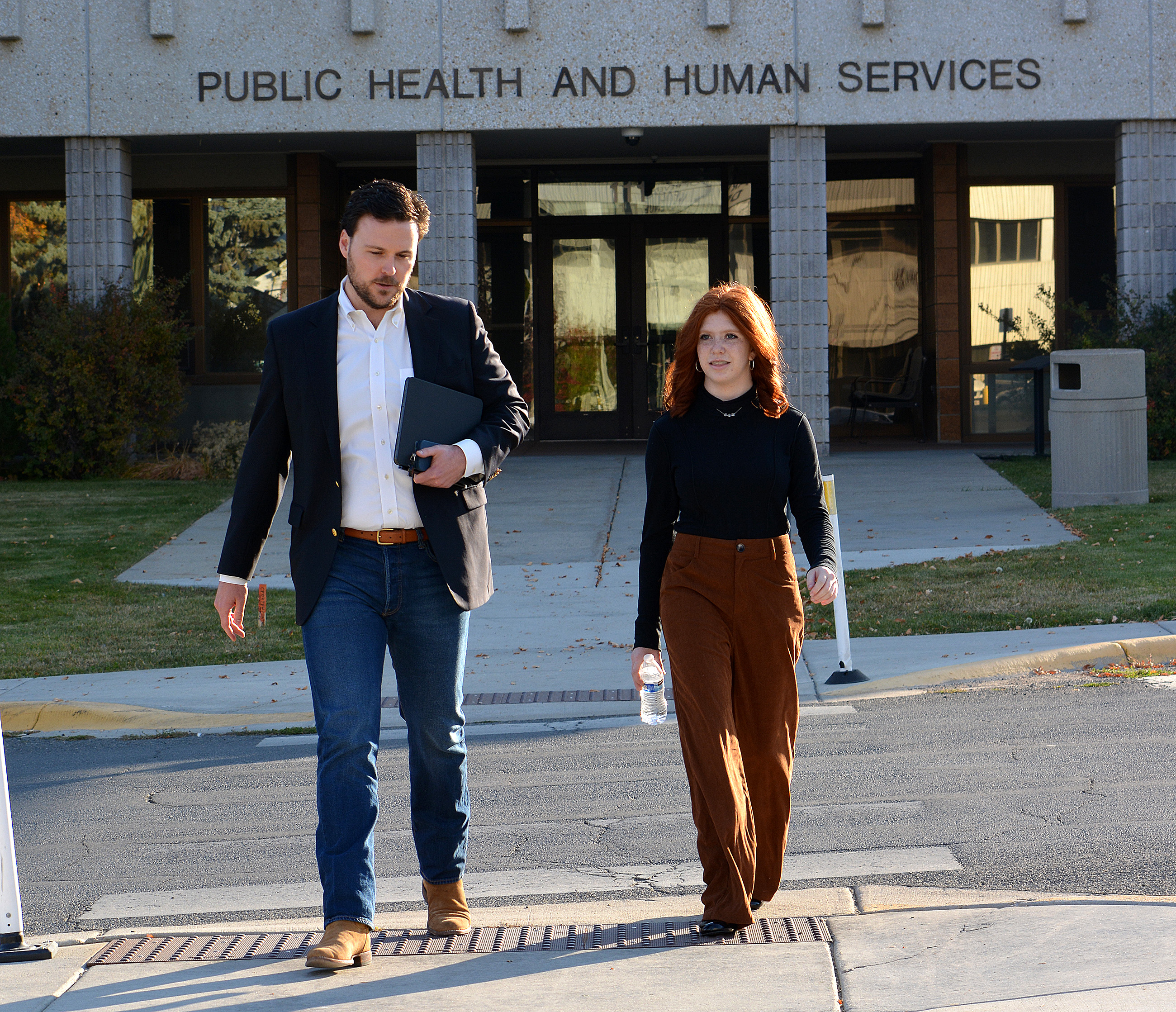 DPHHS Director Charlie Brereton and Helena High School student Layla Riggs walk to the Capitol to meet with Governor Greg Gianforte.