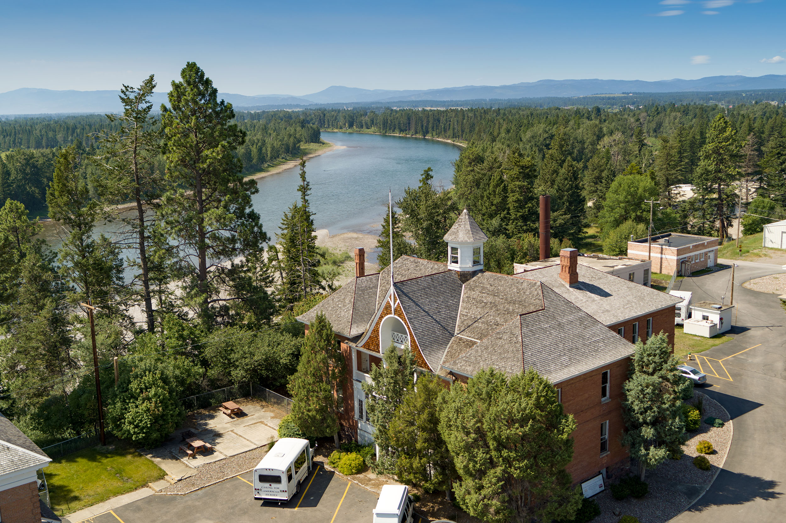 An aerial view of one of the main buildings on the Veterans home campus. The flathead river is in the background.