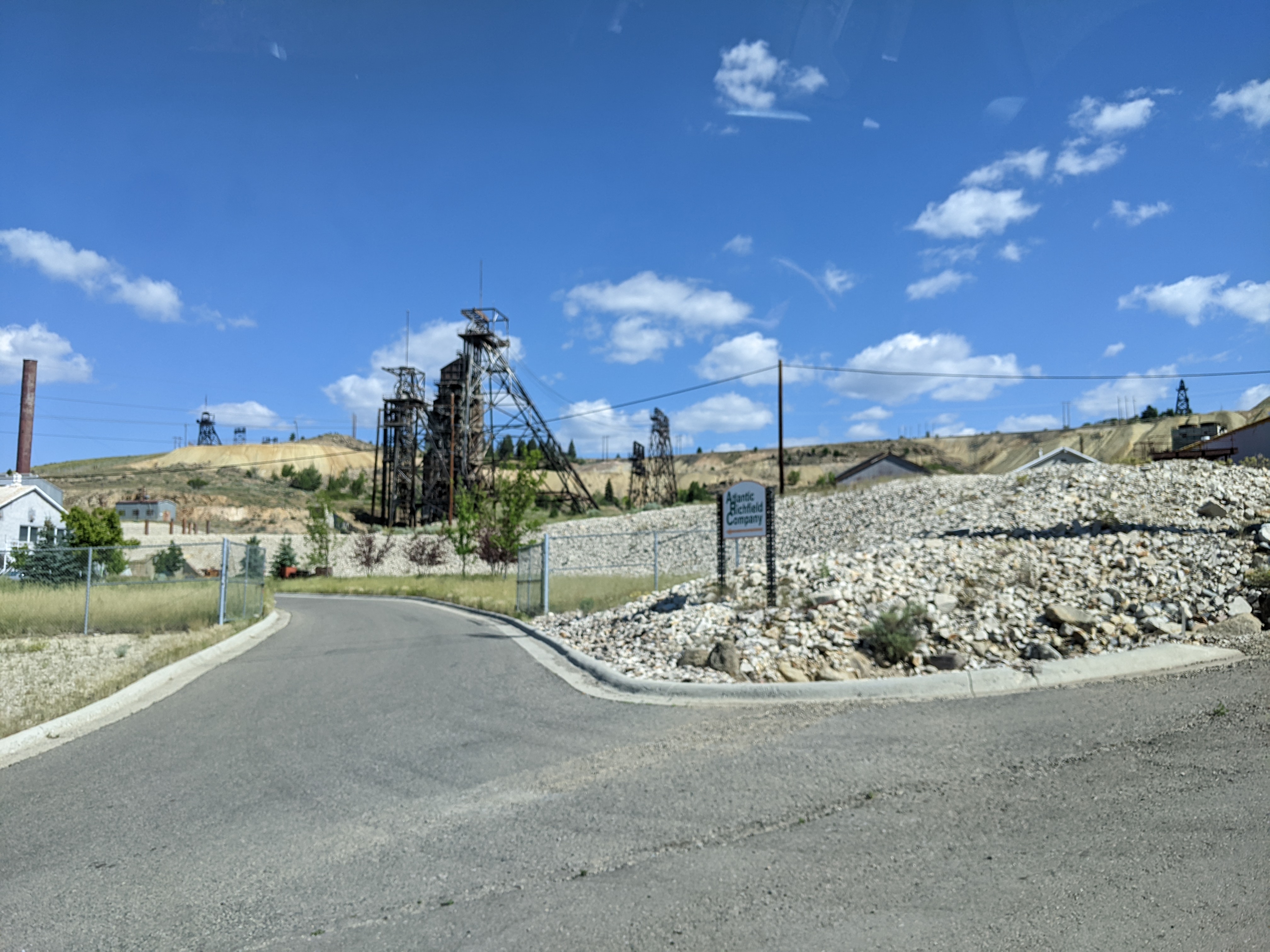 Silver Bow Creek/Butte Area Superfund Site. Long driveway leading to mining headframes. 