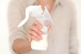 Woman holding a breastpump