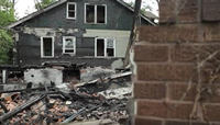 House fire image links to message from home owner on how smoking led to house fire and EMS rescue