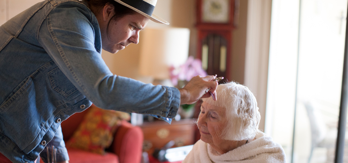 mature-man-cutting-senior-woman-s-hair_1200x564.jpg